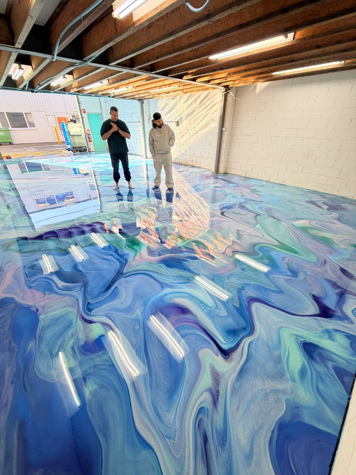 Finished blue, violet and mint epoxy floor
